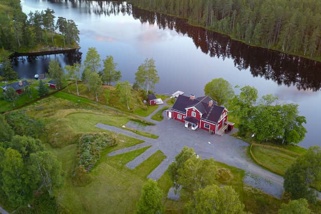 Aerial view of the River Camping with the water and the wilderness surrounding it.